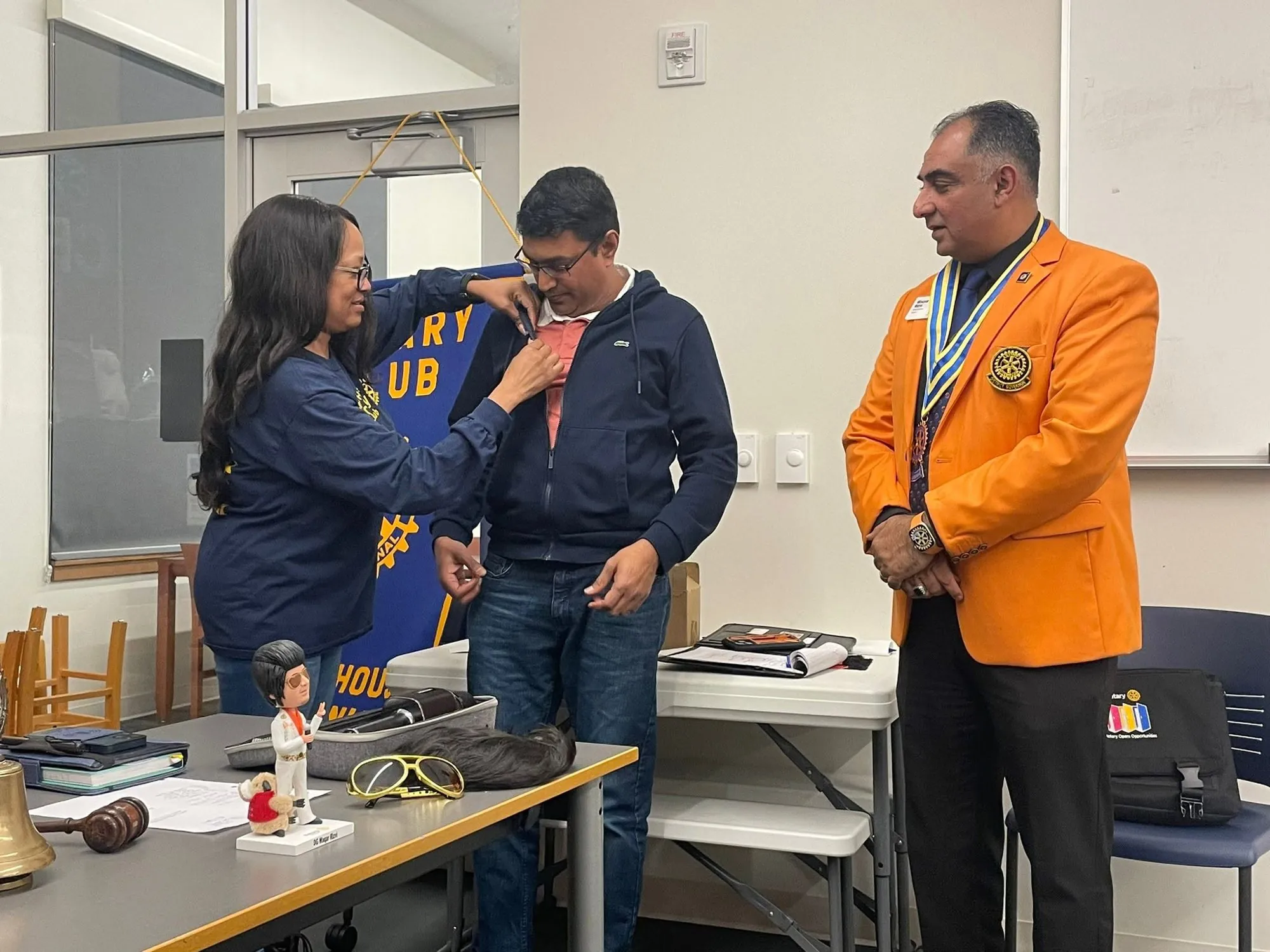 Suresh receiving recognition at a Rotary Club event